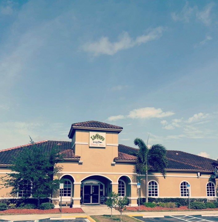 Exterior entrance and Lightsey’s sign at Lightsey’s Seafood Restaurant in Okeechobee